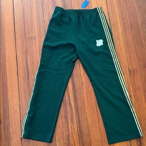 Undefeated Men's Green Joggers with Gold Stripes